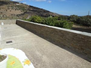 House in the grass land. Andros Greece