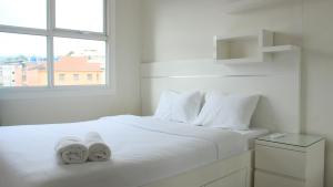 Modest 1BR Apartment at Parahyangan Residence By Travelio