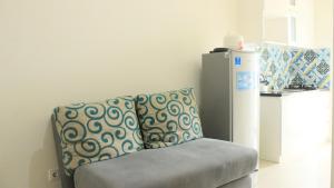 Modest 1BR Apartment at Parahyangan Residence By Travelio