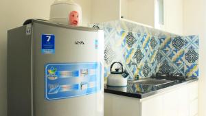 Modest 1BR Apartment at Parahyangan Residence By Travelio