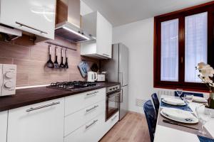 White Flowers with Canal View by Wonderful Italy