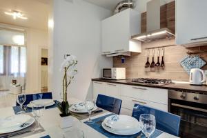 White Flowers with Canal View by Wonderful Italy