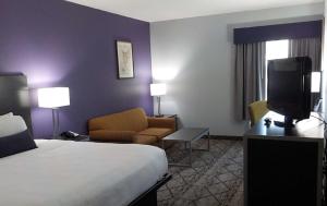 King Room with Sofabed - Interior Corridor room in SureStay Plus Hotel by Best Western Warner Robins AFB