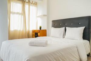 Homey Studio Apartment at Margonda Residence 3 By Travelio