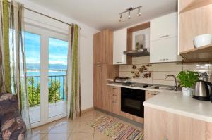 Apartment with a sea view terrace, Čiovo near Trogir