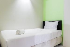 Pool View 2BR at Dian Regency Apartment By Travelio