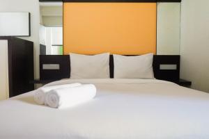 Pool View 2BR at Dian Regency Apartment By Travelio