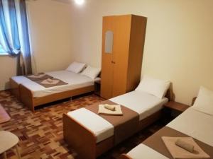 Economy Quadruple Room with Shared Bathroom room in Gostevoi dom BRAVO
