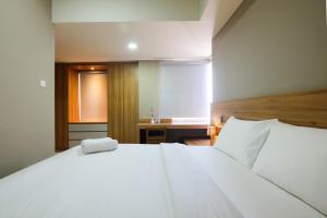 Best Location 1BR Apartment Mustika Golf Residence By Travelio