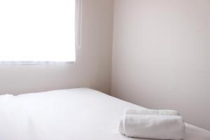 Comfy 2BR Apartment at Grand Asia Afrika By Travelio