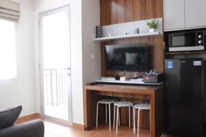 Comfy 2BR Apartment at Grand Asia Afrika By Travelio