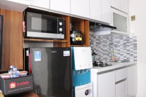 Comfy 2BR Apartment at Grand Asia Afrika By Travelio