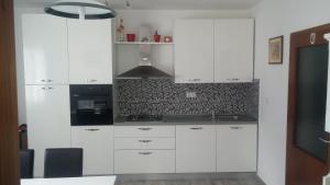 Two-Bedroom Apartment with Terrace and Sea View room in Seaside apartments with a swimming pool Krilo Jesenice Omis - 13898