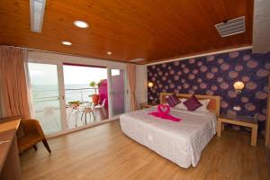 Phòng Deluxe Giường Đôi Với Ban Công và Tầm Nhìn Ra Biển (Deluxe Double Room with Balcony and Sea View)