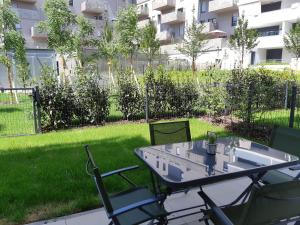 Appartements Le Carre des fleurs : photos des chambres