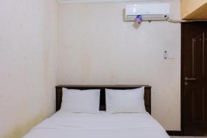 2BR Apartment at 18th Floor Great Western By Travelio