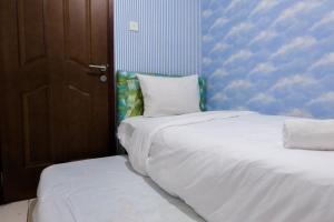2BR Apartment at 18th Floor Great Western By Travelio