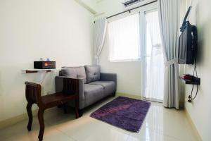 Tranquil 2BR @ Green Pramuka Apartment By Travelio