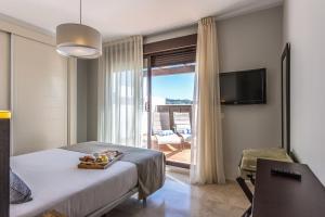 Penthouse Apartment room in Ona Valle Romano Golf & Resort