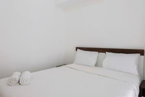 Minimalist 2BR Apartment at M-Town Residence By Travelio