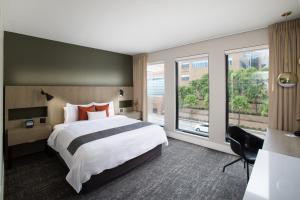 Plush Deluxe King room in The Delaney Hotel