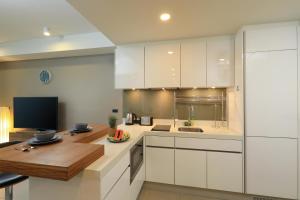 Oceanstone by Holy Cow, studio, next building view