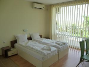 Studio with Balcony room in Holiday and Orchid Fort Noks Apartments