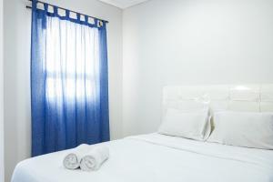 Modern Living 1BR @Atlanta Residences Apartment With City View By Travelio