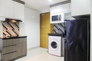 1BR with Working Space The Oasis Cikarang By Travelio