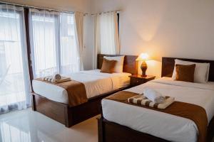 Phòng Deluxe có 2 Giường đơn kèm Quyền lui tới Hồ bơi (Deluxe Twin Room with Pool Access)