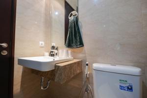 Simply Furnished Studio at Menteng Park Apartment By Travelio