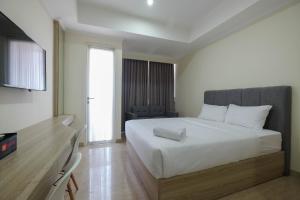 Simply Furnished Studio at Menteng Park Apartment By Travelio