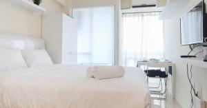Homey and Comfy Studio at Tifolia Apartment By Travelio