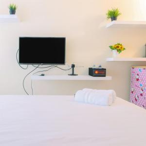 Homey and Comfy Studio at Tifolia Apartment By Travelio