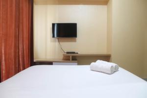 Spacious 1BR at The Oasis Cikarang Apartment By Travelio