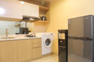 Spacious 1BR at The Oasis Cikarang Apartment By Travelio
