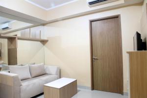 Spacious 1BR at The Oasis Cikarang Apartment By Travelio