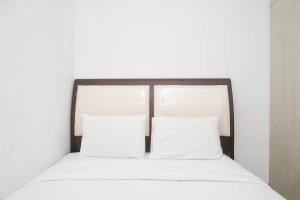 Spacious 2BR Green Bay Pluit Apartment By Travelio