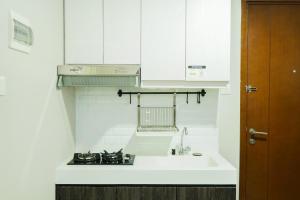 Homey and Comfy 1BR Signature Park Grande Apartment By Travelio