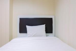 2BR Apartment with City View at Woodland Park Residence By Travelio