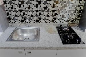 Relaxing Studio Apartment at Tamansari Papilio By Travelio