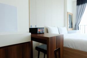 Homey Studio Room Tree Park City BSD Apartment near BSD City By Travelio