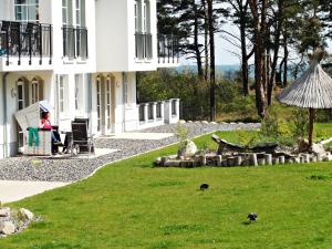 3 Zimmer Ferienwohnung Haus Meeresblick mit Meerblick A005 mit Südterrasse und Strandkorb