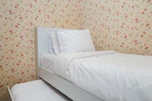 Comfy and Clean 2BR Green Pramuka City Apartment By Travelio