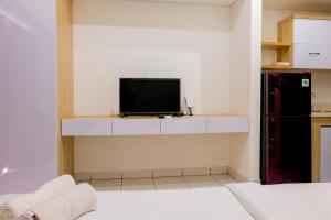 Homey Studio at Casa De Parco Apartment By Travelio