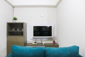 1BR with Extra Balcony The Oasis Cikarang Apartment By Travelio