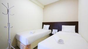 Clean and Cozy 2BR Apartment Parahyangan Residence By Travelio