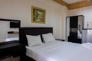 City View Studio at Green Bay Pluit Apartment By Travelio