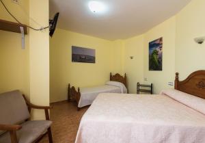 Triple Room (2 Adults + 1 Child) room in Hostal O Camouco