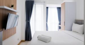 Comfy Studio at M-Town Gading Serpong Apartment By Travelio